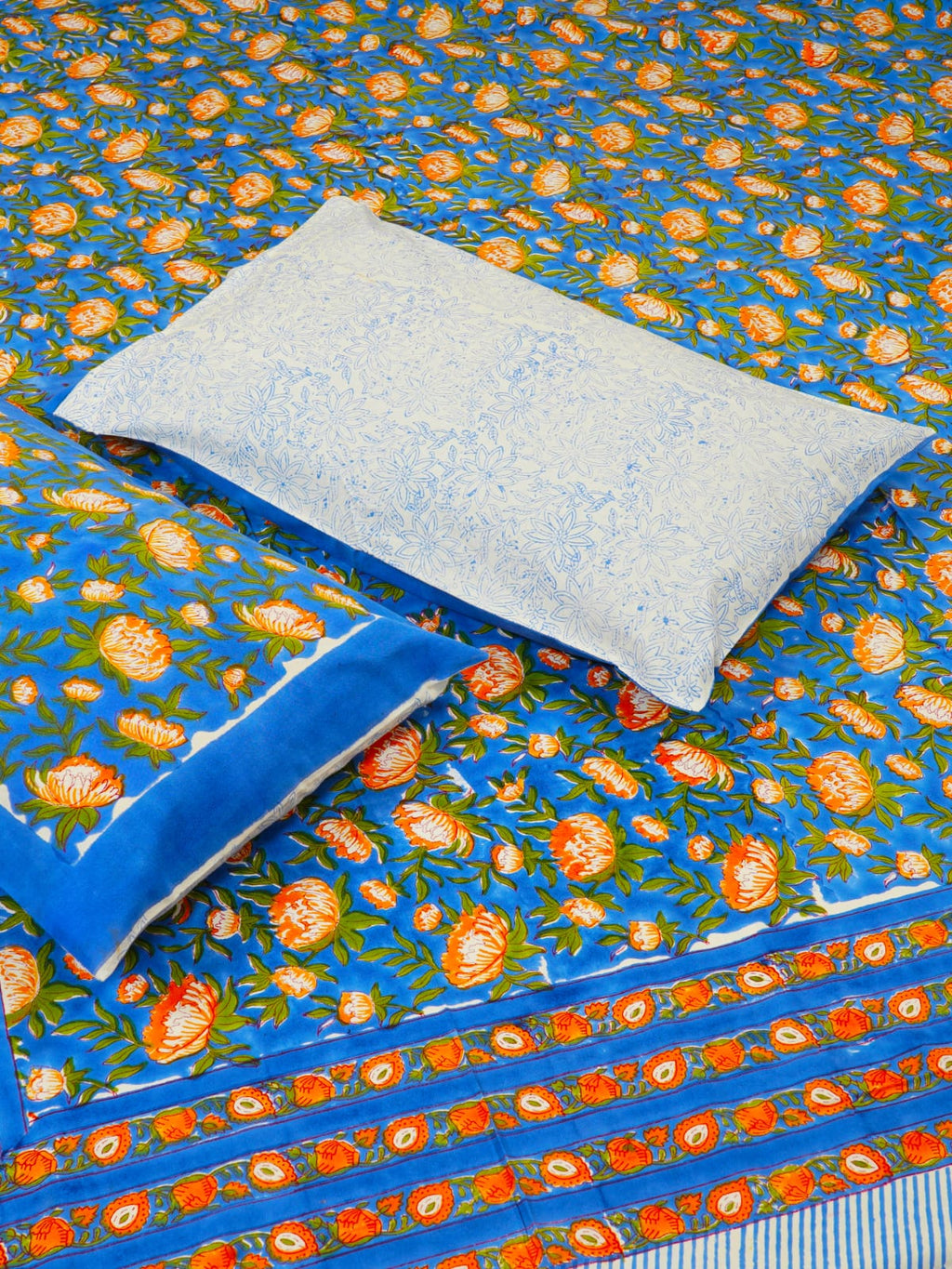Floral-patterned fabric with a pillow on top