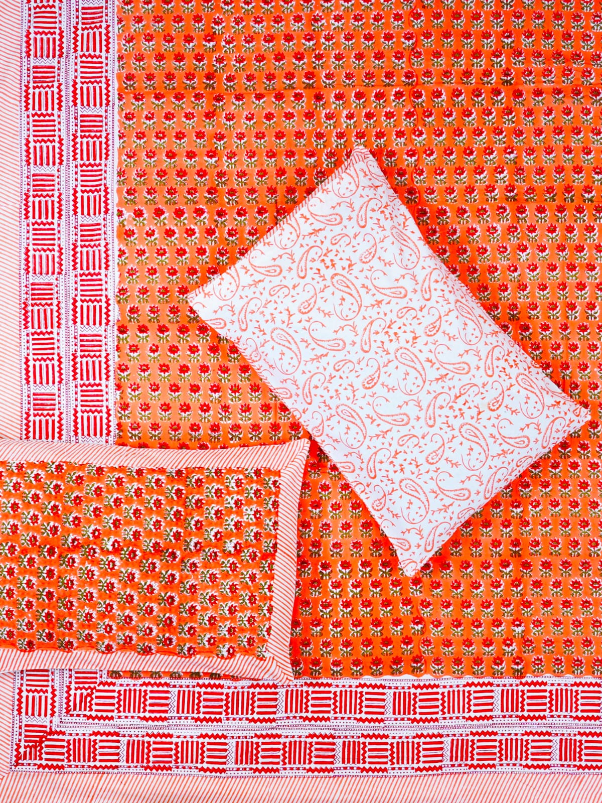 Orange fabric with white patterned square and red border